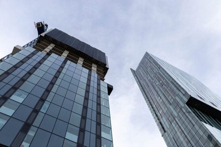A horizontal background photo of two modern office skyscrapers.の写真素材