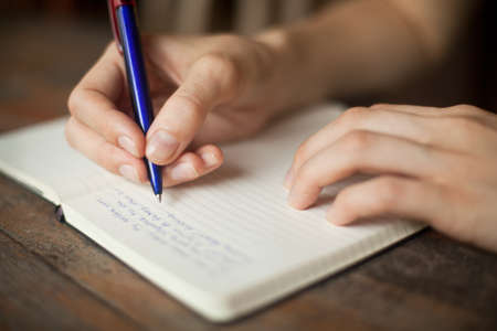 Abstract hands writing on the paper