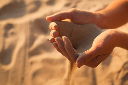 time passing, sand in the hands