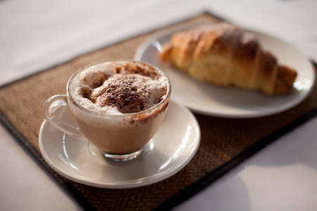 breakfast, coffee and croissant on the tableの写真素材