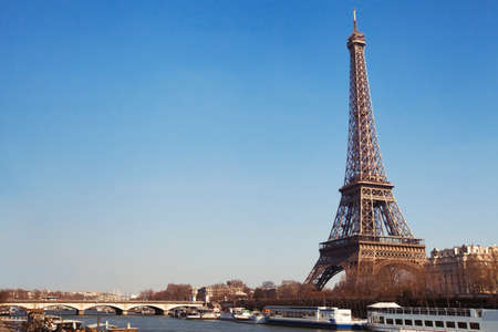 Eiffel Tower and bridge over Seine river in Paris, Franceの写真素材