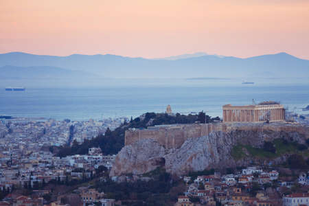 beautiful sunset over Athens in Greece, panoramic view of Acropolis hillの写真素材