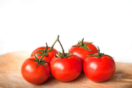 tomatoes in the kitchen isolated on whiteの写真素材