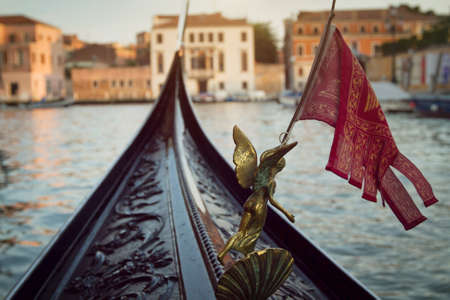 gondola with the flag in Venice, Italyの写真素材