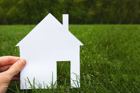 real estate concept, hand holding houseの写真素材
