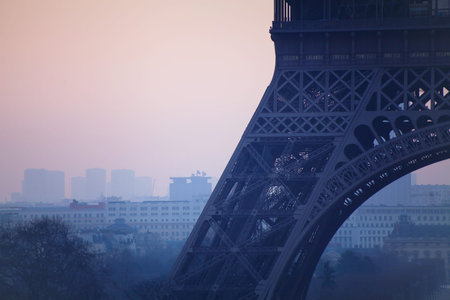 close up of Eiffel tower, pollution in Paris, France