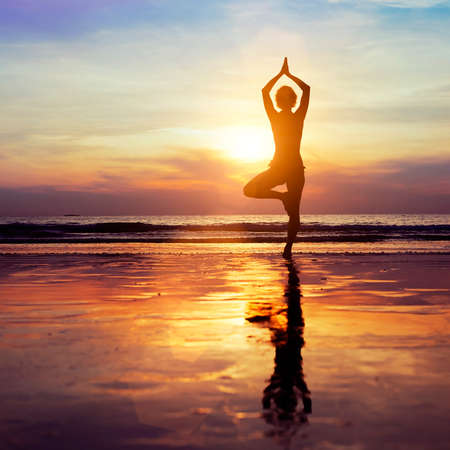 yoga on the beach, healthy lifestyle conceptの写真素材