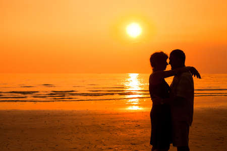 happy retired couple on the beachの写真素材