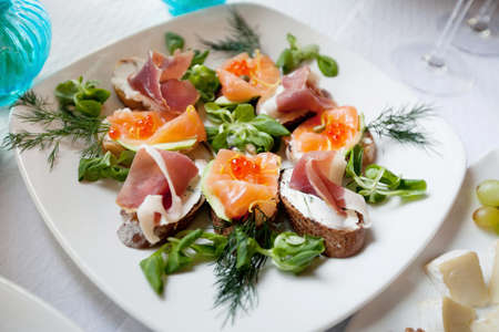 delicious snacks, canape on the plateの写真素材