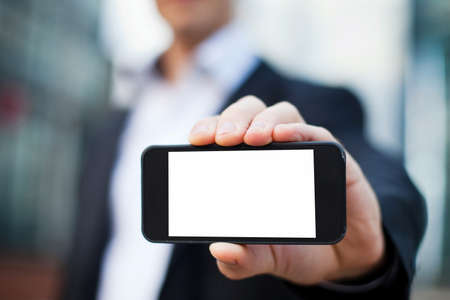 businessman showing smartphone with isolated screenの写真素材