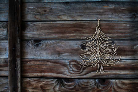 christmas tree on wooden background, new year cardの写真素材