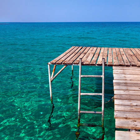 beach pier for jumping, fishing and snorkelingの写真素材