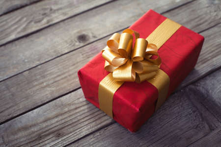 beautiful vintage gift on the wooden desk - for christmas or birthdayの写真素材