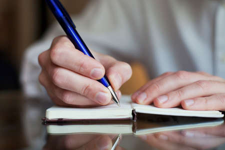 business man write in the notepadの写真素材