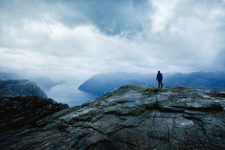 traveler on the top of the mountain with panoramic viewの写真素材