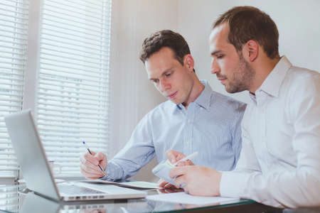 business people working on project in modern office interiorの写真素材