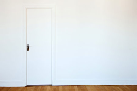 white door on white wall, real estate backgroundの写真素材