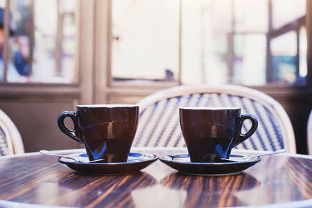 two cups of coffee on the table in cafe in Parisの写真素材