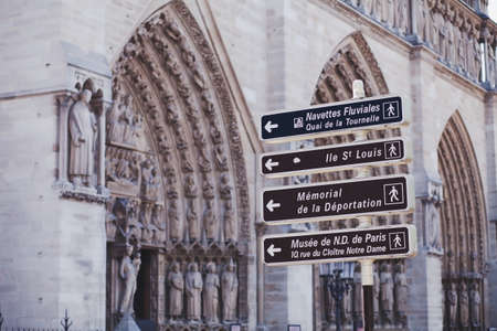 direction sign near Notre Dame, touristic sights of Parisの写真素材