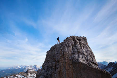 achievment concept, climber on top of the mountainの写真素材