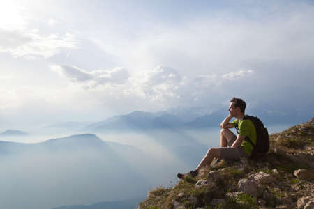 traveler enjoying panoramic view during hike, beautiful background with mountain landscapeの写真素材
