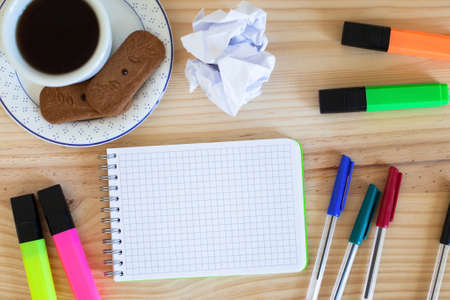 notepad and colorful markers on the table, top viewの写真素材