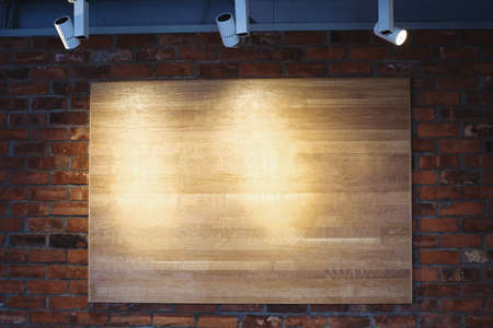 wooden board background on brick wallの写真素材