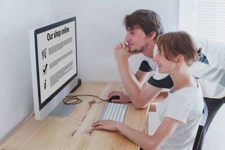 shopping online concept, family looking to the screen of computerの写真素材