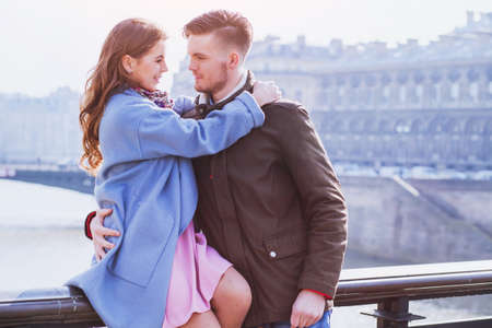 young happy couple looking to each other, spring fashion portraitの写真素材