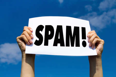 spam alert, hands holding paper signの写真素材