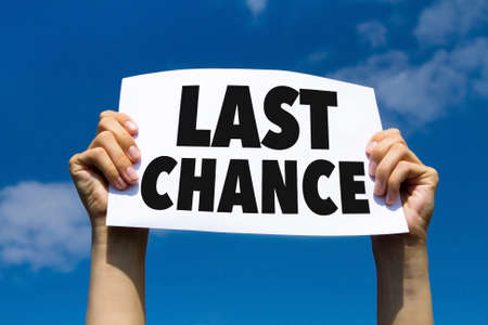 last chance, concept, hands holding paper signの写真素材