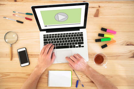 video play button on the screen of laptop computer, audio streaming online, multimedia websiteの写真素材