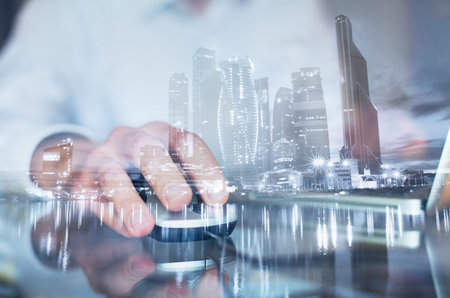 double exposure of hand with mouse, business man working on computer online