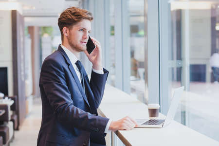 businessman on the phone, business travel, airportの写真素材