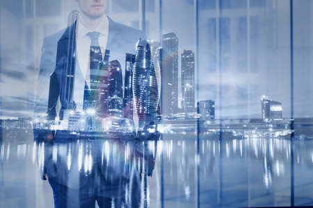 double exposure of businessman with modern city skyline, business backgroundの写真素材