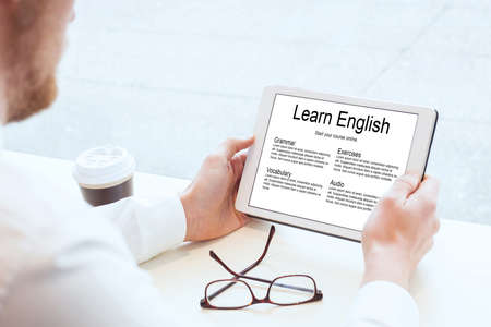 business man learning english onlineの写真素材