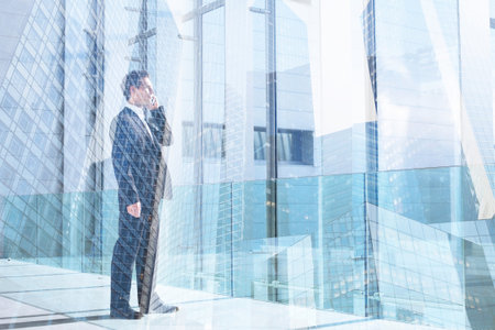 business man talking by mobile phone in the office, communication or success concept double exposure, callの写真素材