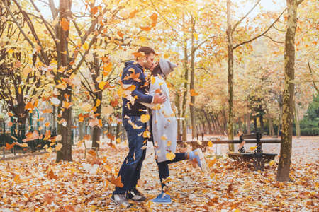 couple kissing in autumn park, fallの写真素材