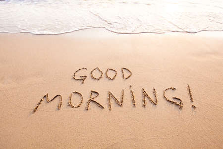 Good morning, message text concept card, text written on sand beachの写真素材