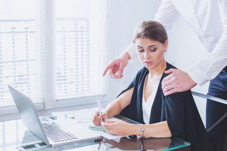Sexual harassment at work, office woman and her lustful bossの写真素材