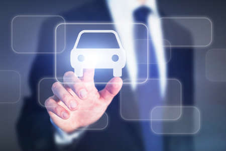 car rental concept, businessman pushing virtual button on touchscreen onlineの写真素材