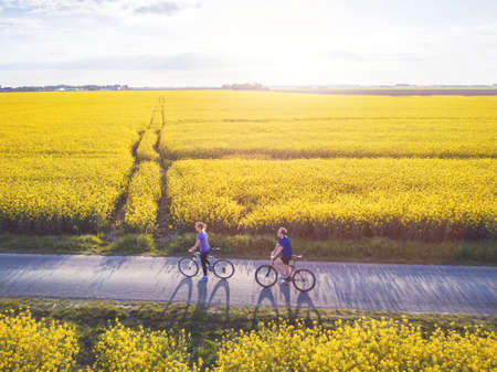 cycling, group of young people with bicycles, aerial viewの写真素材