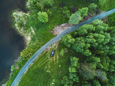 beautiful aerial view of countryside road in green forest, landscape from droneの写真素材