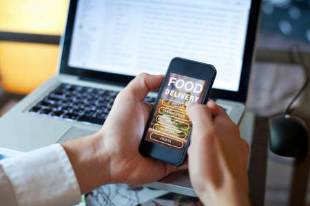 order food on internet, restaurant meals delivery onlineの写真素材