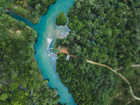 Thailand aerial landscape, drone view of river in green tropical forest, beautiful nature scenery of jungle wildernessの写真素材