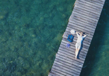 happy tourist on the beach, tropical holidays, vacation travel background with copy spaceの写真素材