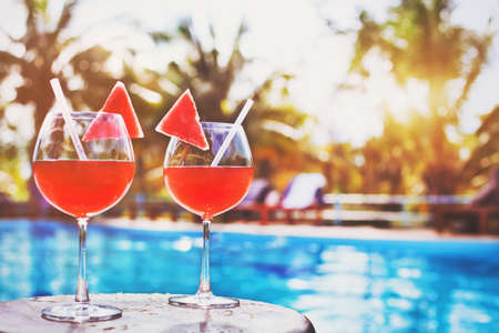 two glasses of exotic cocktail on tropical beachの写真素材