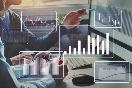 Big data analytics, financial charts, business team working on computer as background. Development and growth concept.の写真素材