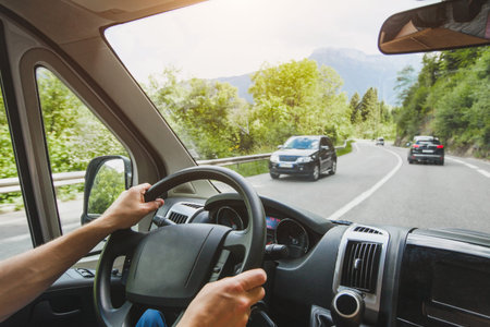 hands of truck driver on steering wheel, delivery service, transportation occupation, man driving...