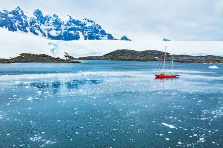 sailing boat in Antarctica, travel by yacht cruise, beautiful remote tourism destinationの写真素材